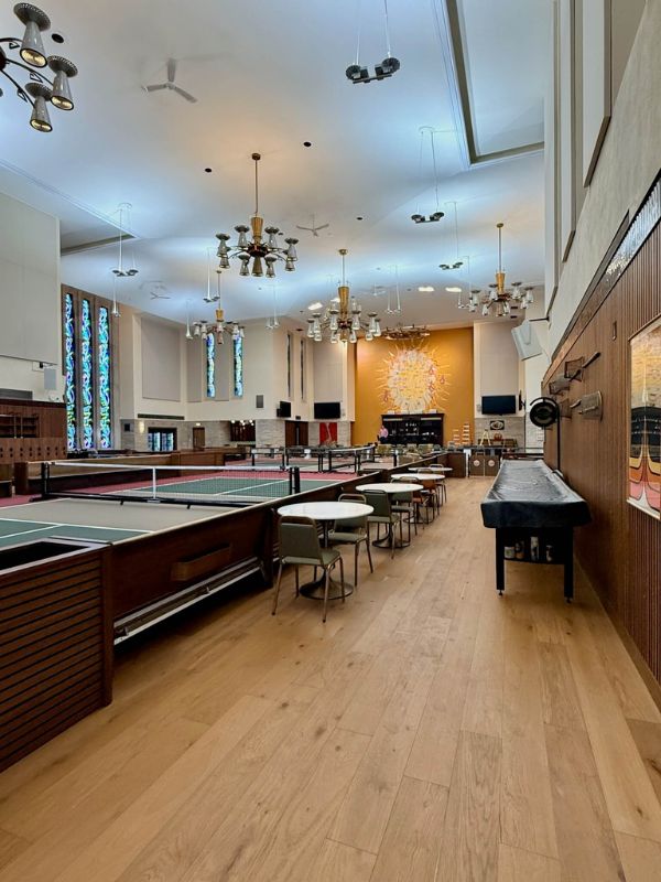 Commercial hardwood flooring installed in seating and pickleball court area at Church of Pickleball in Chicago Illinois
